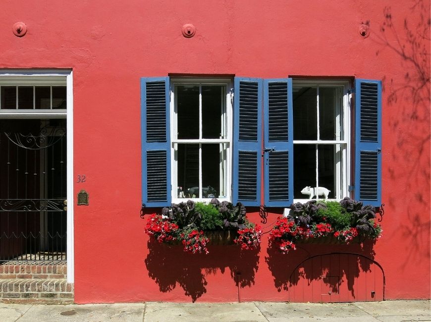 red house with blue shutters