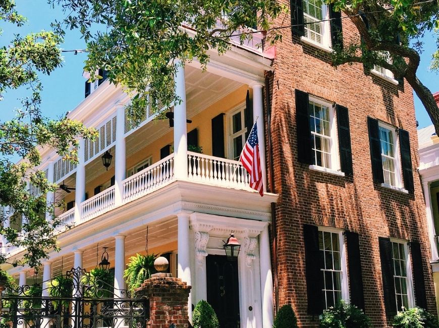 brick house with black shutters